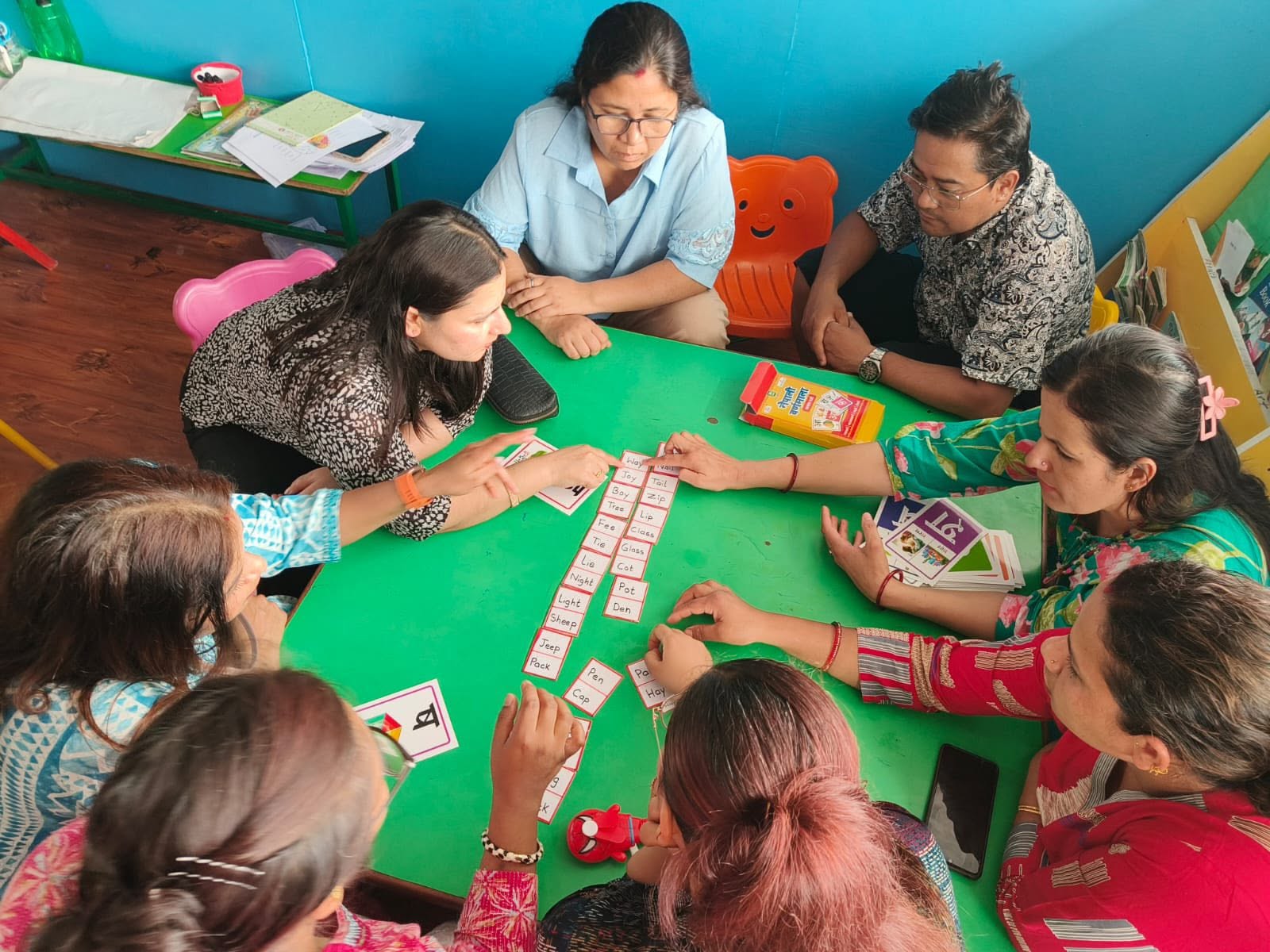 Teachers taking part in a Montessori phonics and word-building training session